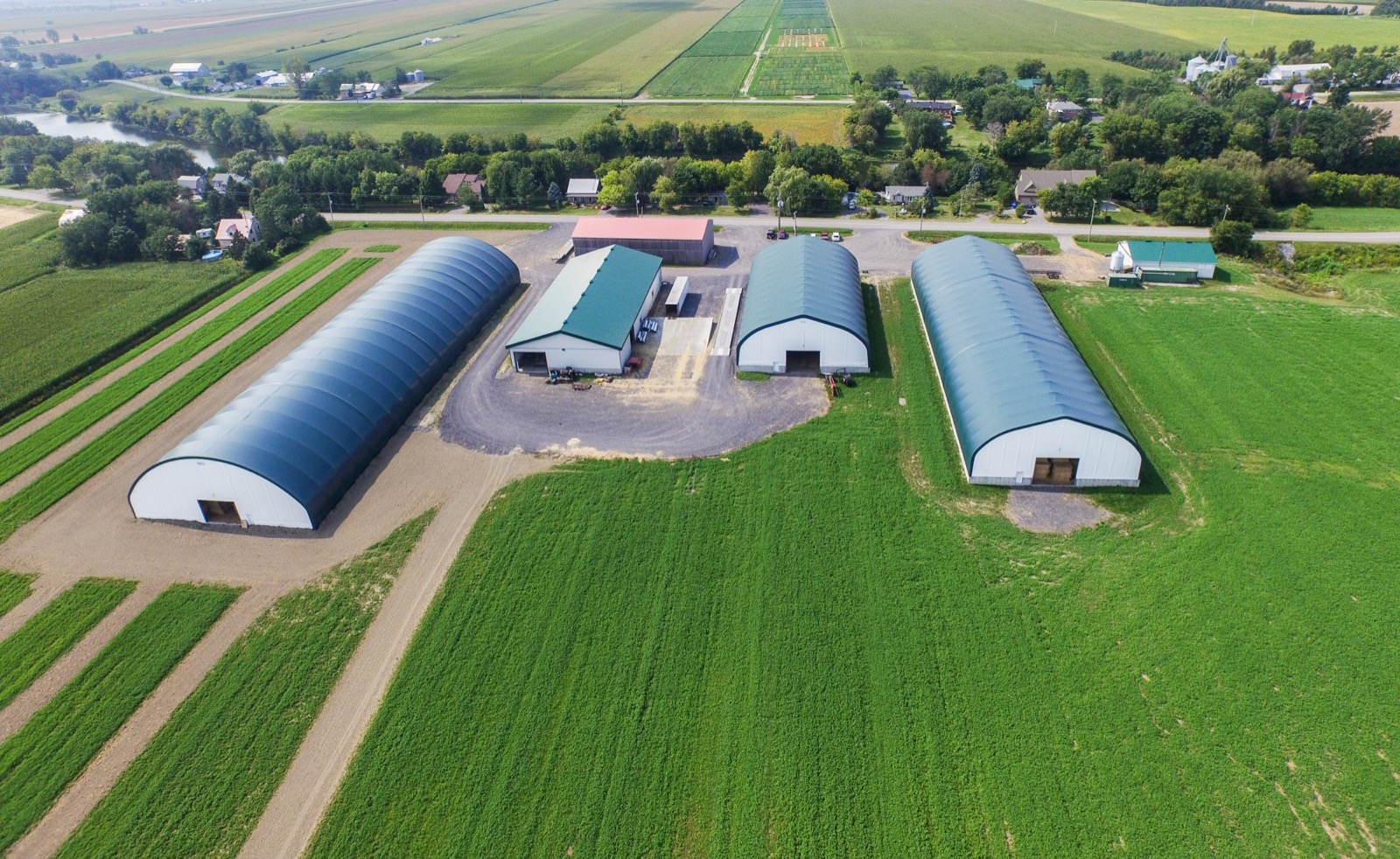 Aerial view of multiple fabric buildings on a working farm in Ontario