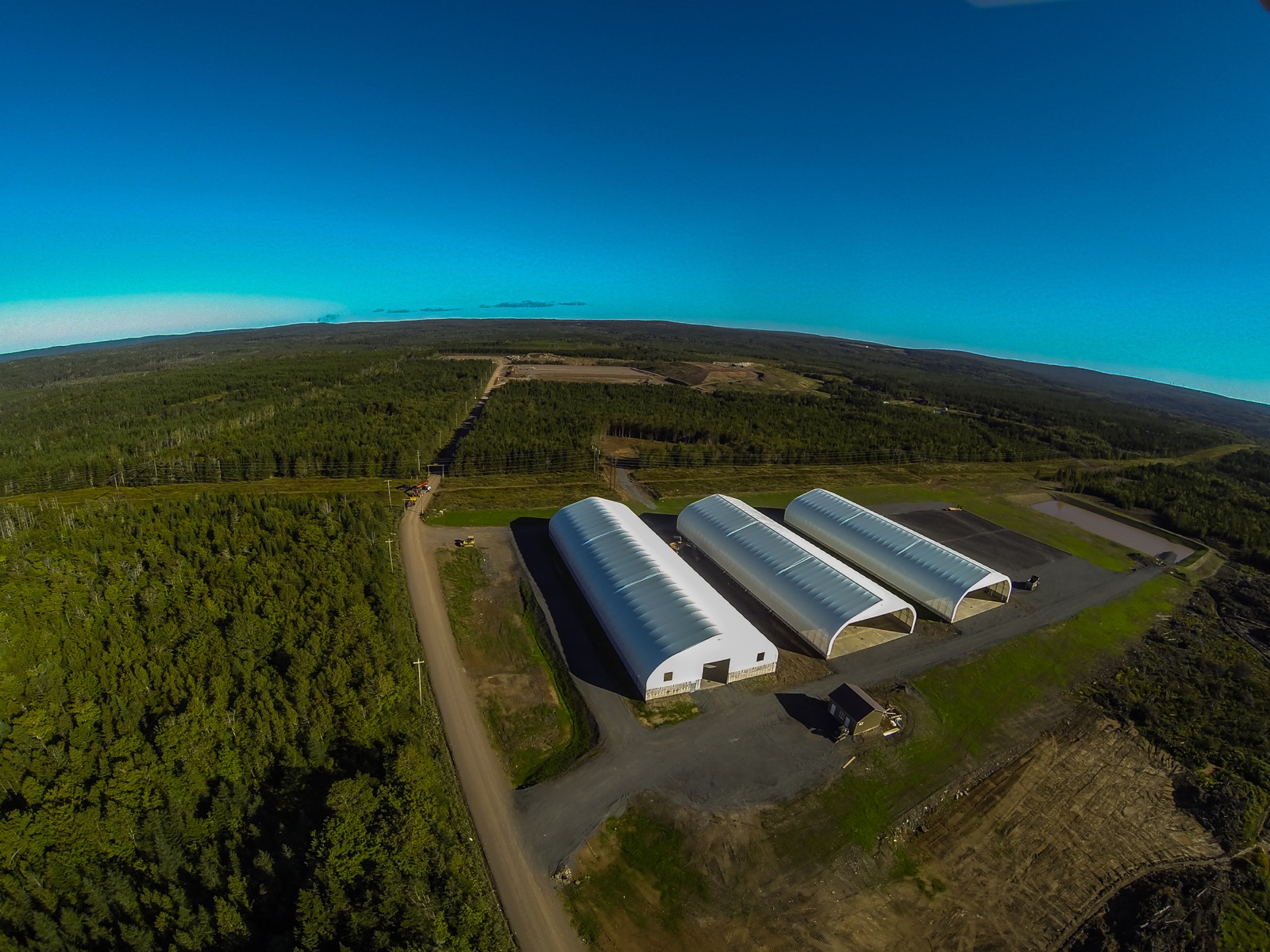 Aerial view of three municipal fabric buildings for public works in Ontario
