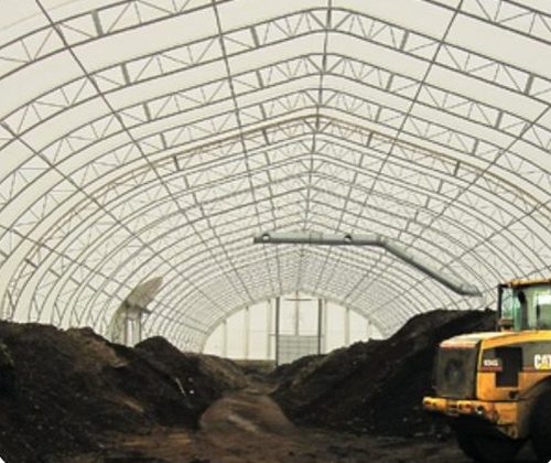 Fire-retardant membrane on a commercial fabric building