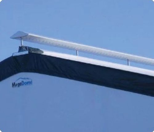 Fabric building ridge vent along peak for passive exhaust